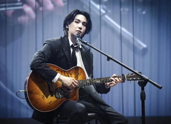 Suga Playing the Guitar: Is BTS Teasing a New Album? Suga Playing the Guitar: Is BTS Teasing a New Album?